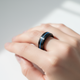 Premium smart ring with crystal display technology on white background showing elegant health monitoring design